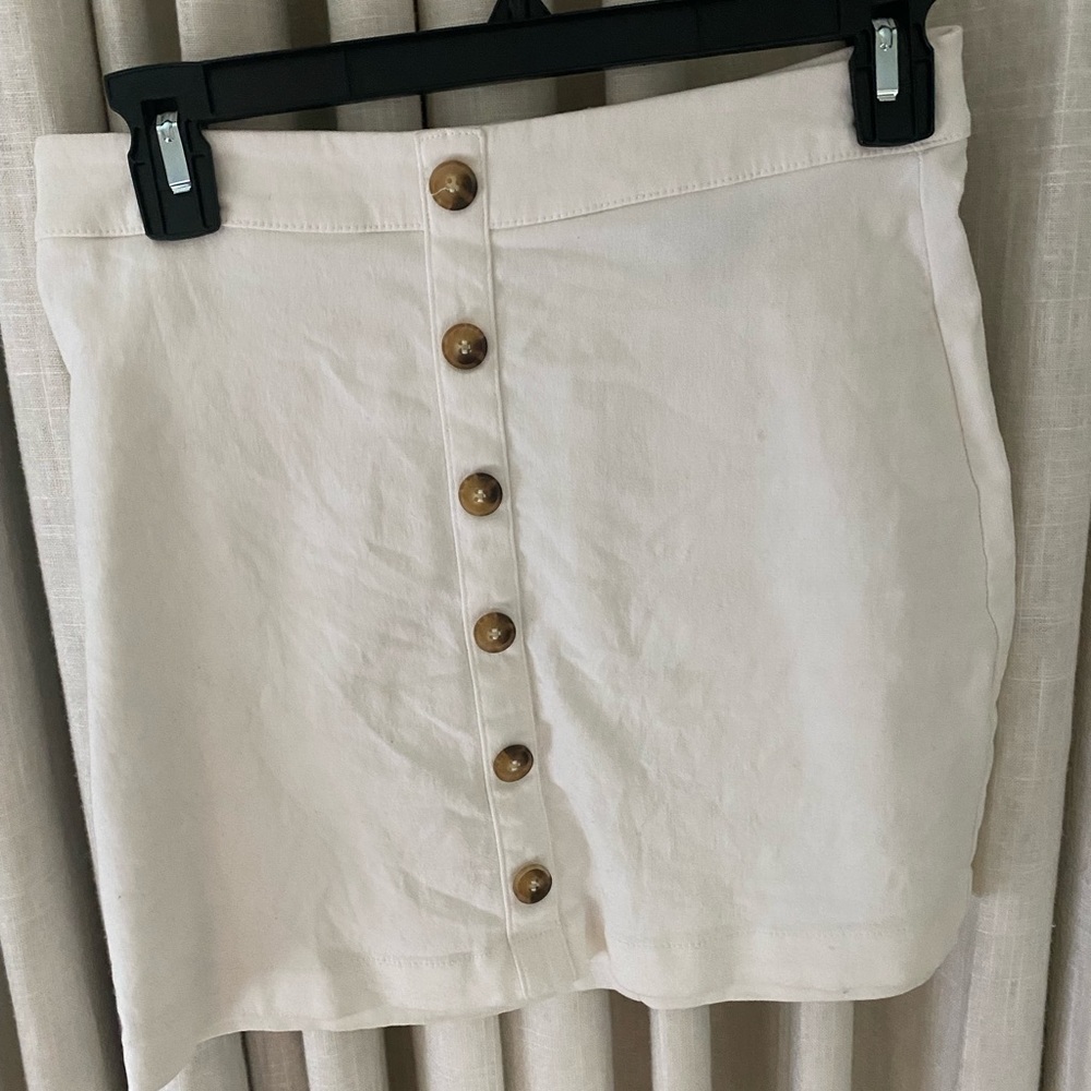 White jean skirt with buttons on the front